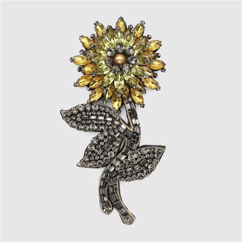 gucci crystal flower brooch.